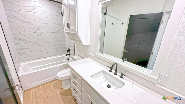 1486 Walker Place Blvd, Copperas Cove, TX 76522 - bathroom with a textured wall, toilet, wood finished floors, vanity, and shower / bathing tub combination