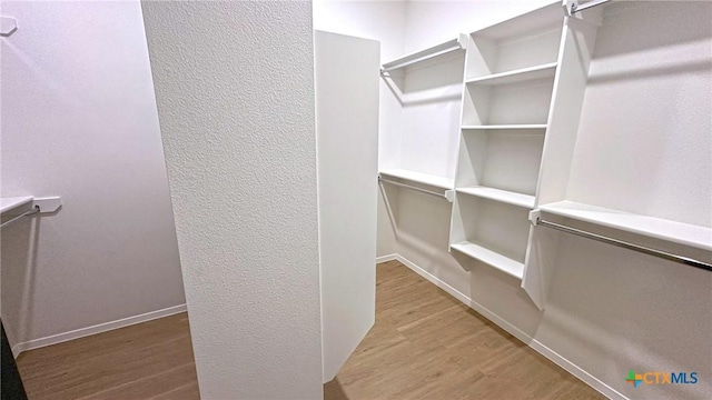 1486 Walker Place Blvd, Copperas Cove, TX 76522 - spacious closet with wood finished floors