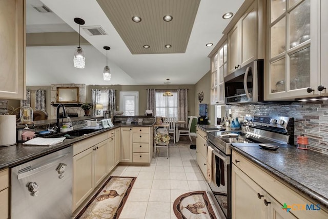kitchen with visible vents, dark countertops, and stainless steel appliances
