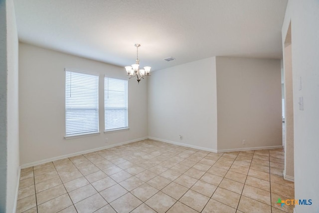 2241 Windswept Way, New Braunfels, TX 78132 - empty room featuring a chandelier, light tile patterned floors, and baseboards