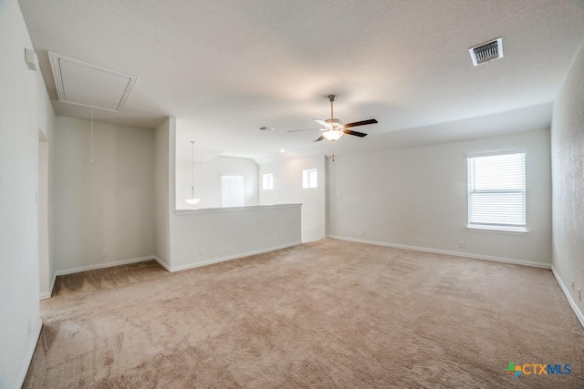 2241 Windswept Way, New Braunfels, TX 78132 - empty room with attic access, light carpet, ceiling fan, and baseboards