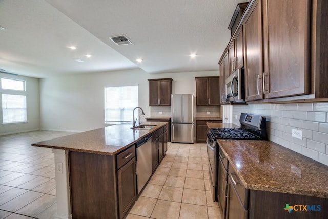 2241 Windswept Way, New Braunfels, TX 78132 - kitchen featuring stainless steel appliances, a sink, decorative backsplash, light tile patterned flooring, and recessed lighting