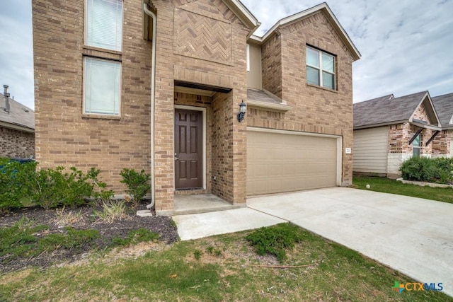2241 Windswept Way, New Braunfels, TX 78132 - view of front facade featuring a garage, driveway, and brick siding