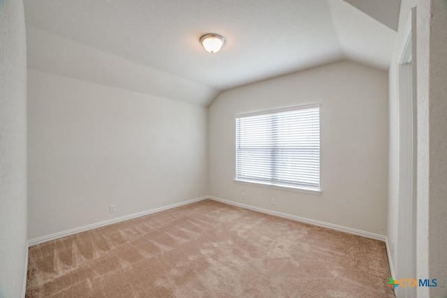 2241 Windswept Way, New Braunfels, TX 78132 - empty room featuring lofted ceiling, light colored carpet, and baseboards