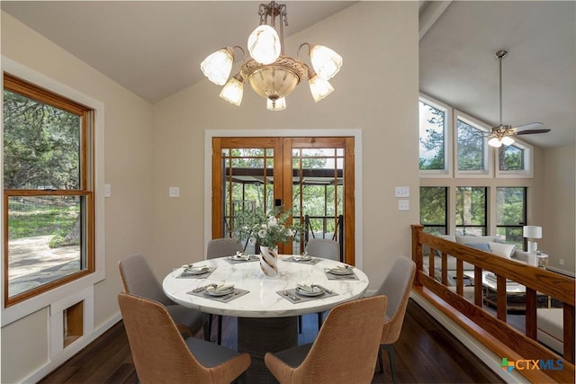 1143 Flaman Rd, Canyon Lake, TX 78133 - dining area featuring dark wood-style floors, a chandelier, ceiling fan, and high vaulted ceiling