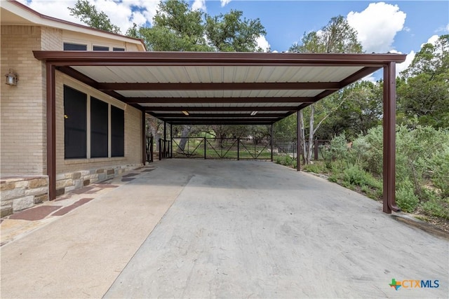 1143 Flaman Rd, Canyon Lake, TX 78133 - view of car parking with a carport and concrete driveway