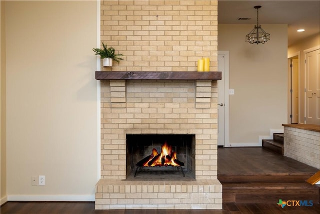 1143 Flaman Rd, Canyon Lake, TX 78133 - detailed view of wood finished floors, a fireplace, and recessed lighting