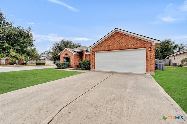 ranch-style house featuring an attached garage, central air condition unit, brick siding, driveway, and a front yard