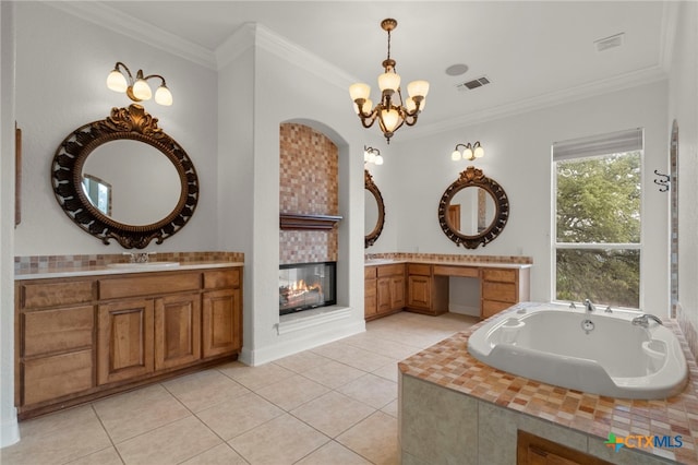 bathroom with visible vents, crown molding, a chandelier, tile patterned flooring, and a tile fireplace