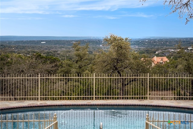 view of pool with fence and a fenced in pool