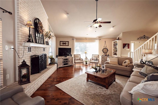 3501 Grizzly Bear Trl, Temple, TX 76502 - living area featuring ceiling fan, hardwood / wood-style flooring, vaulted ceiling, a brick fireplace, and stairs