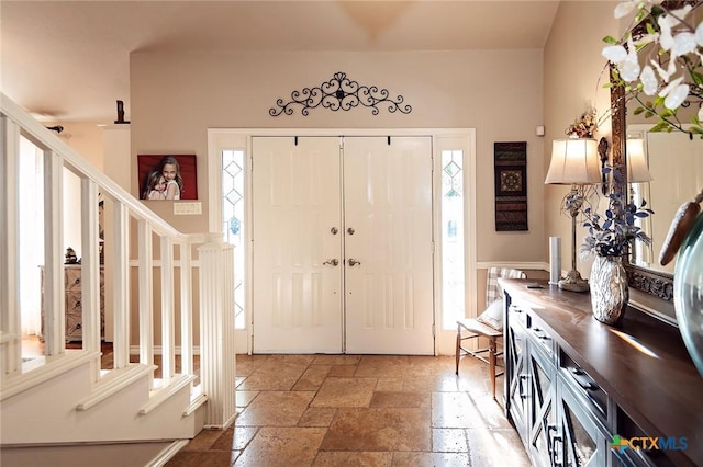 3501 Grizzly Bear Trl, Temple, TX 76502 - entrance foyer with stairs, healthy amount of natural light, and stone tile flooring