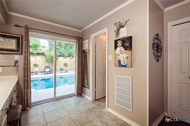 3501 Grizzly Bear Trl, Temple, TX 76502 - doorway featuring ornamental molding, baseboards, and light tile patterned flooring