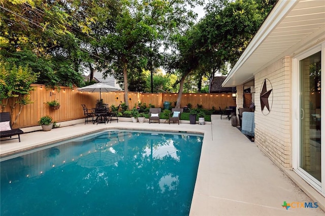 3501 Grizzly Bear Trl, Temple, TX 76502 - view of pool featuring a patio area, a fenced backyard, and outdoor dining space