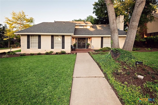 3501 Grizzly Bear Trl, Temple, TX 76502 - view of front of property with brick siding, a front yard, and roof with shingles