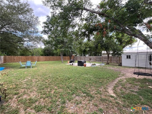 1210 N Milam St, Seguin, TX 78155 - fenced backyard featuring a fire pit