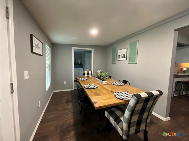 1210 N Milam St, Seguin, TX 78155 - dining area with baseboards and dark wood finished floors