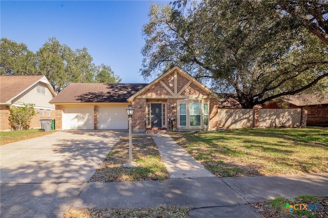 104 Salisbury Ln, Victoria, TX 77904 - view of front of house with brick siding, an attached garage, and driveway