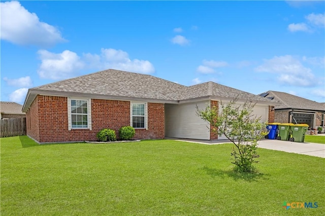 503 Chrislyn St, Troy, TX 76579 - ranch-style home featuring an attached garage, concrete driveway, brick siding, and a shingled roof
