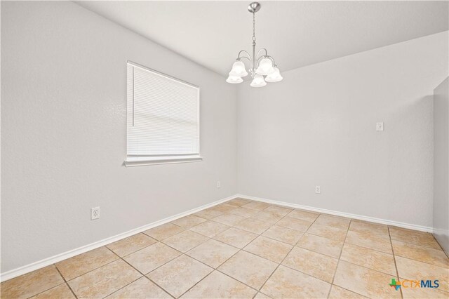 503 Chrislyn St, Troy, TX 76579 - empty room with light tile patterned floors and a chandelier