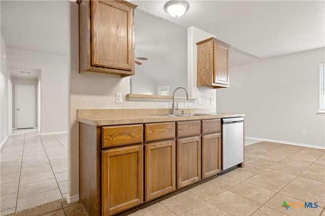 503 Chrislyn St, Troy, TX 76579 - kitchen featuring dishwasher, light tile patterned floors, and light countertops