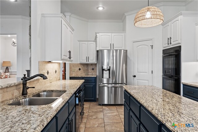 kitchen featuring sink, blue cabinets, decorative backsplash, white cabinets, and black appliances