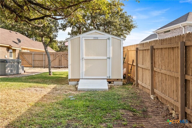 view of outdoor structure featuring a lawn