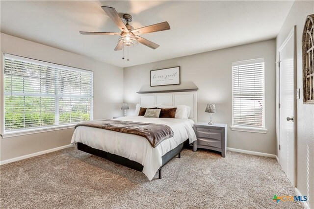 bedroom with light carpet and ceiling fan