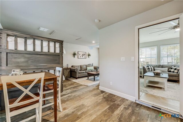 dining room featuring hardwood / wood-style flooring and ceiling fan