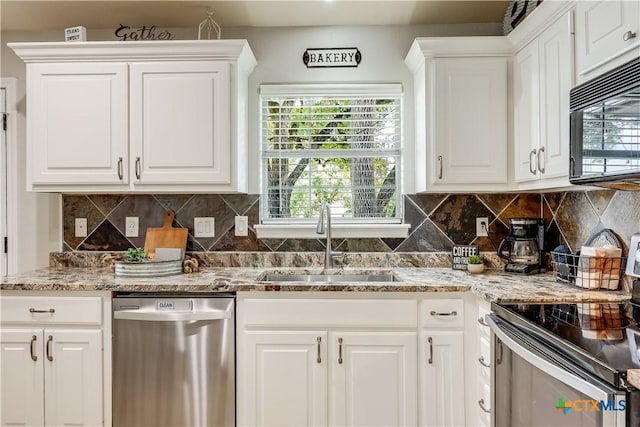 kitchen featuring stainless steel appliances, sink, and white cabinets