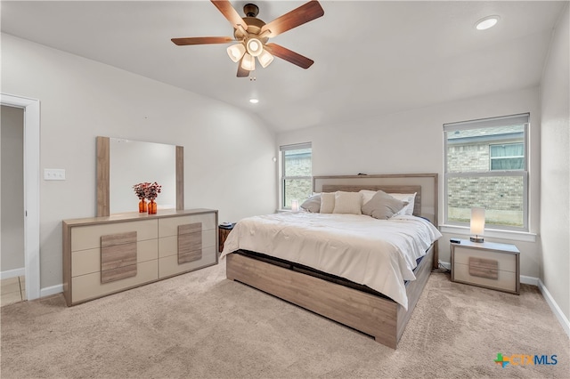 carpeted bedroom featuring lofted ceiling and ceiling fan