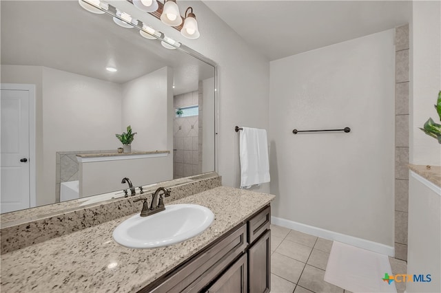 bathroom featuring tile patterned flooring and vanity