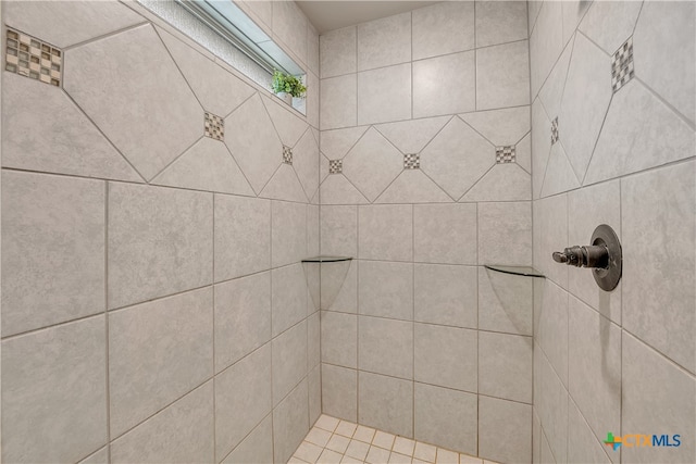 bathroom with tiled shower