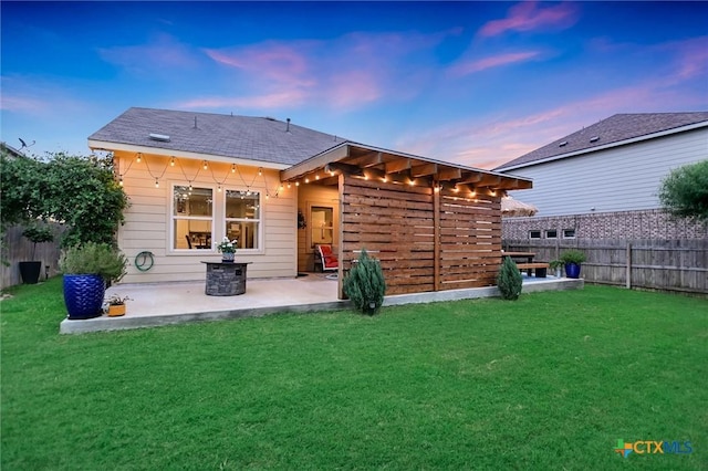 272 Adoquin Trl, Buda, TX 78610 - back of property with a patio area and roof with shingles
