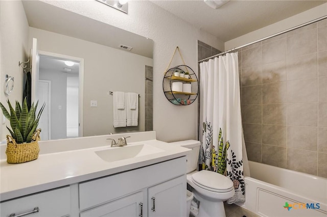272 Adoquin Trl, Buda, TX 78610 - bathroom featuring vanity, toilet, and shower / tub combo with curtain