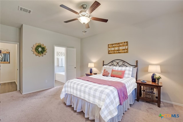 272 Adoquin Trl, Buda, TX 78610 - bedroom featuring carpet flooring, baseboards, connected bathroom, and ceiling fan