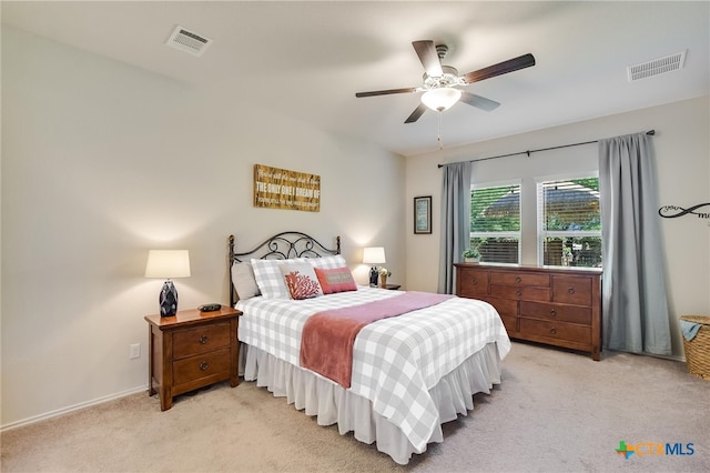 272 Adoquin Trl, Buda, TX 78610 - bedroom with light carpet, ceiling fan, and baseboards