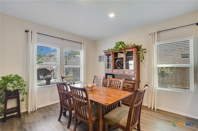 272 Adoquin Trl, Buda, TX 78610 - dining room featuring wood finished floors, baseboards, and recessed lighting