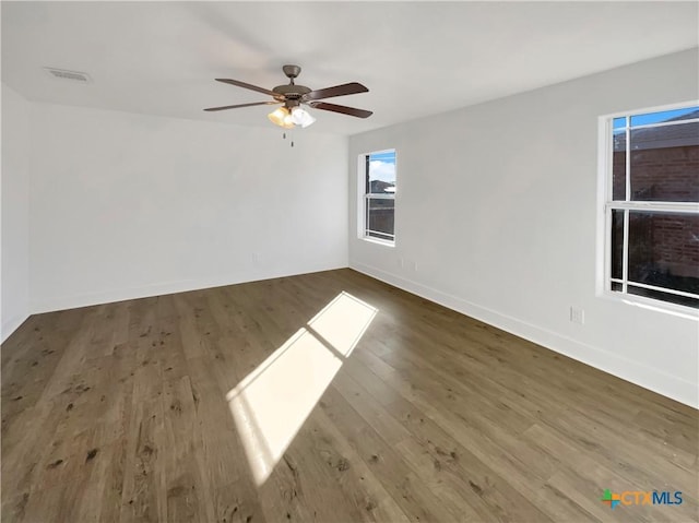 5004 Imperial Eagle Dr, Killeen, TX 76549 - unfurnished room featuring ceiling fan, wood finished floors, visible vents, and baseboards