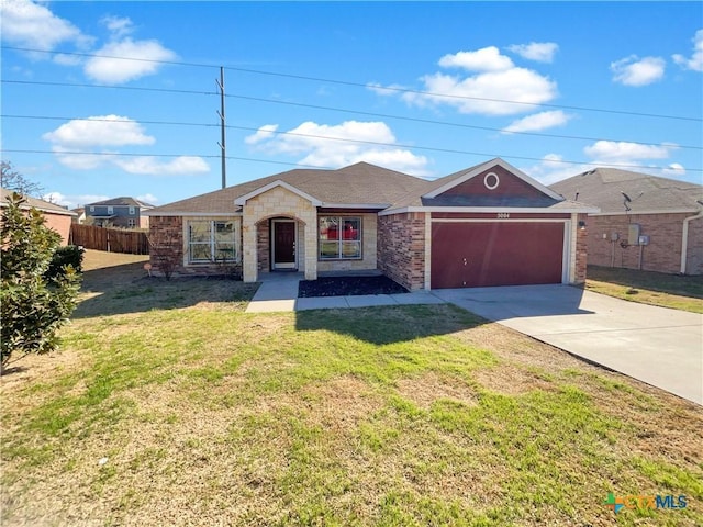 5004 Imperial Eagle Dr, Killeen, TX 76549 - ranch-style house with fence, a front yard, a garage, stone siding, and driveway