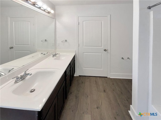 5004 Imperial Eagle Dr, Killeen, TX 76549 - bathroom featuring a sink, wood finished floors, and double vanity
