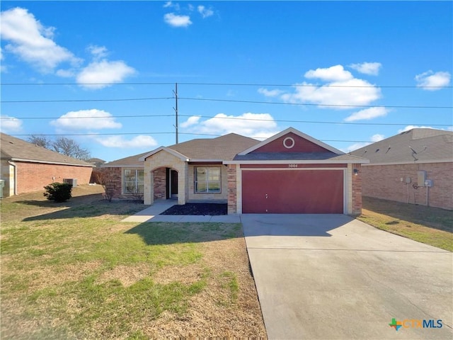 ranch-style house featuring driveway, an attached garage, a front lawn, and brick siding