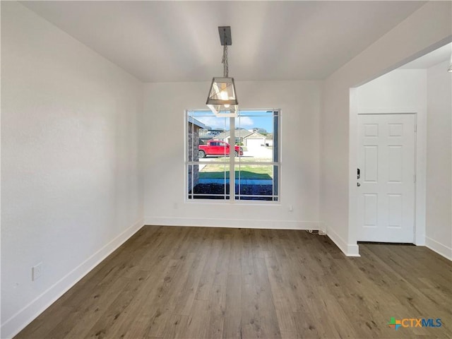 5004 Imperial Eagle Dr, Killeen, TX 76549 - unfurnished dining area featuring baseboards and wood finished floors