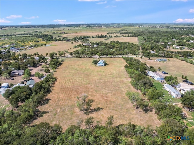 birds eye view of property featuring a rural view