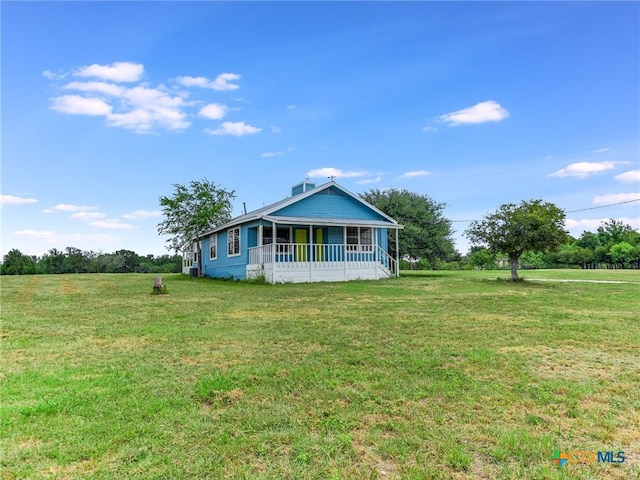 exterior space with a front lawn and covered porch