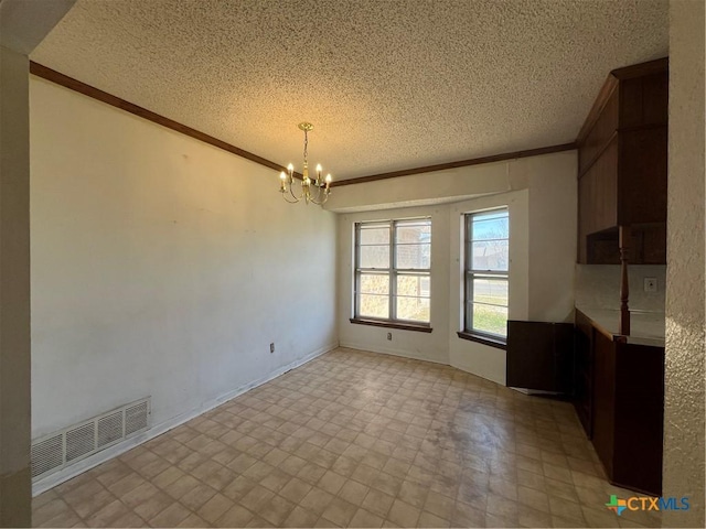 unfurnished dining area with a chandelier, visible vents, light floors, and crown molding