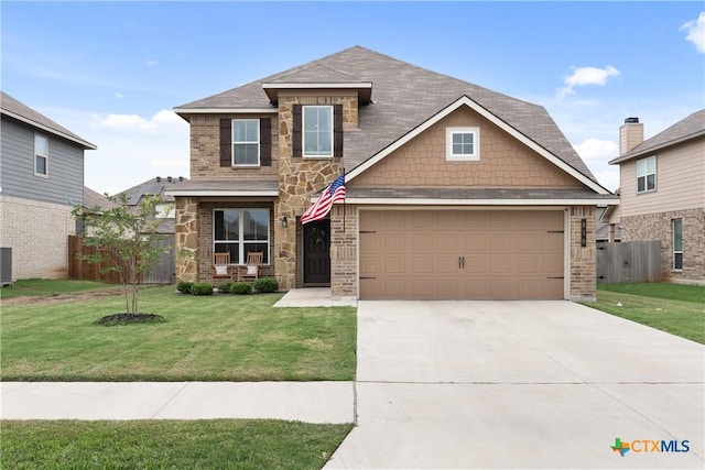 810 Mclaury Cv, Killeen, TX 76542 - craftsman-style home featuring driveway, fence, a front yard, and stone siding