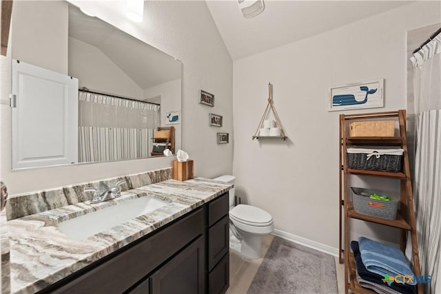 810 Mclaury Cv, Killeen, TX 76542 - full bath with tile patterned flooring, vanity, toilet, baseboards, and vaulted ceiling