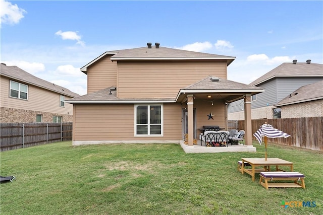 810 Mclaury Cv, Killeen, TX 76542 - rear view of house with a fenced backyard, a patio, and a yard