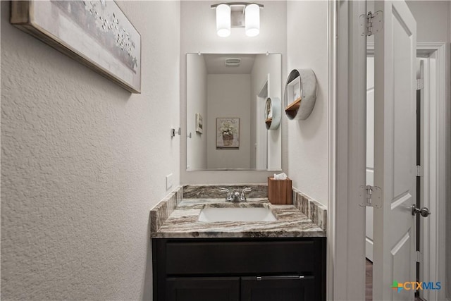 810 Mclaury Cv, Killeen, TX 76542 - bathroom featuring vanity and a textured wall